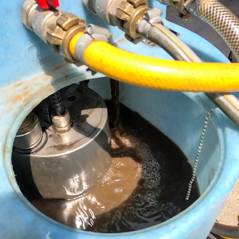 Dirty heating water being cleaned with a powerflush machine